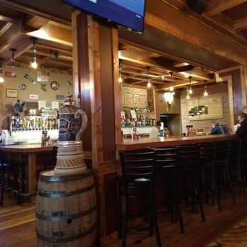 Hoppers Pub - a bar with a large television above the bar - Pubs Near Me - Rolla, Missouri