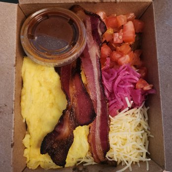 ORGANICO - breakfast bowl with salsa, bacon, scrambled eggs, shredded cheese, chopped tomato, and pickled onions. black beans and potatoes as base. - Juice Bars & Smoothies Near Me - Pasadena, California