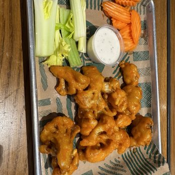 The Watering Hole - a tray of chicken wings, carrots and celery - Bars Near Me - Chandler, Arizona The Watering Hole - a tray of chicken wings, carrots and celery - Bars Near Me - Chandler, Arizona