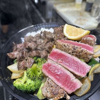 Arayaki Hibachi - a person holding a plate of food - Food Trucks Near Me - Riverside, California Arayaki Hibachi - a person holding a plate of food - Food Trucks Near Me - Riverside, California