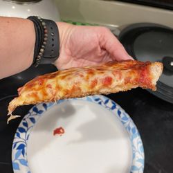 Bethel Pizza House - Side view of cheese slice