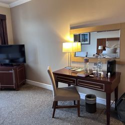 The Brehon - Desk and hidden refrigerator under tv