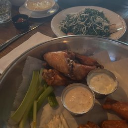 Wings, kale Caesar, fries with cheese Wings, kale Caesar, fries with cheese