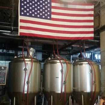 Yonkers Brewing Co. - American flag over the Beer tanks.. - Gastropubs Near Me - Yonkers, New York Yonkers Brewing Co. - American flag over the Beer tanks.. - Gastropubs Near Me - Yonkers, New York