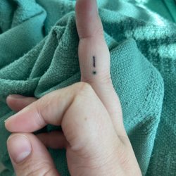 Rix Tattoos & Body Piercing - The dot is very "blurry" looking. Maybe that could have been avoided?