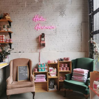 Cafecito - a pink neon sign on a brick wall - Coffee & Tea Near Me - Montreal, Quebec