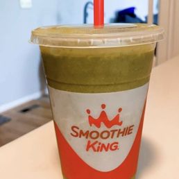 a smoothie in a plastic cup with a straw a smoothie in a plastic cup with a straw