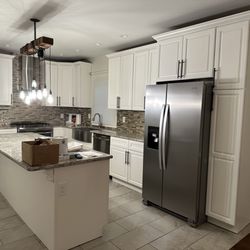 Another happy client! Dark brown cabinets painted white (Montclair, NJ)