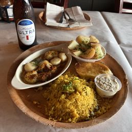 Scalops w/garlic butter yellow rice and parsley potatoes Scalops w/garlic butter yellow rice and parsley potatoes