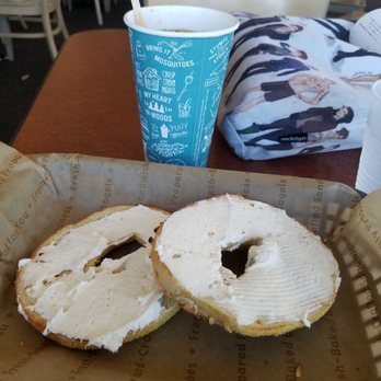 Einstein Bros. Bagels - Toasted Onion bagel with a smear and medium coffee Harry Styles style bag for attention - Bagels Near Me - Reno, Nevada Einstein Bros. Bagels - Toasted Onion bagel with a smear and medium coffee Harry Styles style bag for attention - Bagels Near Me - Reno, Nevada