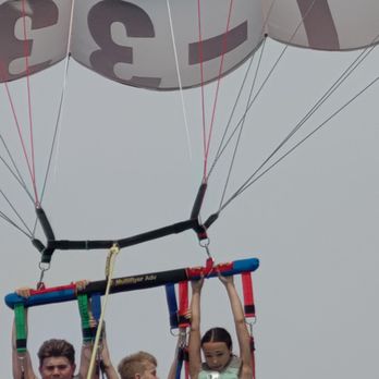 New Wave Watersports - Flying high - Parasailing Near Me - North Myrtle Beach, South Carolina