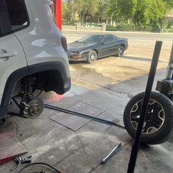 Big 8 Tire - My Jeep in Big 8 garage with wheel removed to be checked and cleaned of debris from unpaved road.