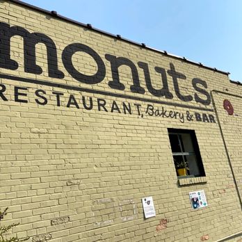 Monuts - a sign on the side of a restaurant - Donuts Near Me - Durham, North Carolina