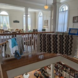 Laura's Tea Room - View of the upstairs tea room and the main floor shopping area.