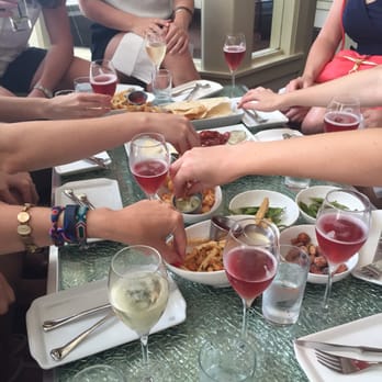 Pops for Champagne - Spread of appetizers and champagne - Wine Bars Near Me - Chicago, Illinois Pops for Champagne - Spread of appetizers and champagne - Wine Bars Near Me - Chicago, Illinois
