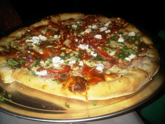 Photo of Addie's Pizza Pie - Berkeley, CA, US. Summer squash pizza with goat cheese, corn and red onions.