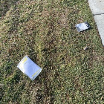 Ashley Store - Trash on grass. - Furniture Stores Near Me - Burbank, California