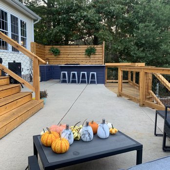 Square East building - Outdoor kitchen space, custom wire railings & new stairway. - General Contractors Near Me