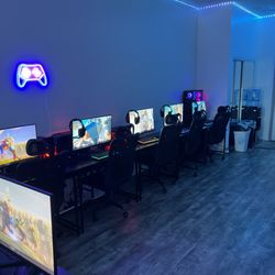 The Hotspot Gaming Cafe - Back area has 5 computers all in a line.