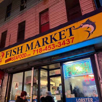 Fish Market - people walking in front of a fish market - Seafood Markets Near Me - Brooklyn, New York