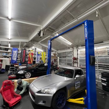Chevron - a car being worked on in a garage - Gas Stations Near Me - Oakland, California