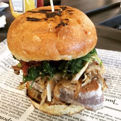 QDC Burger - KONG Ahi Tuna Burger - Grilled yellowtail tuna, Asian marinated cucumbers, wakame, tomato chutney, oyster mushrooms, wasabi aioli.