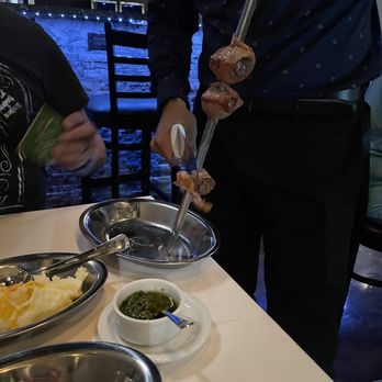 Bitelo Brazilian Steakhouse - a man preparing a meal - Steakhouses Near Me - Cedar Park, Texas Bitelo Brazilian Steakhouse - a man preparing a meal - Steakhouses Near Me - Cedar Park, Texas