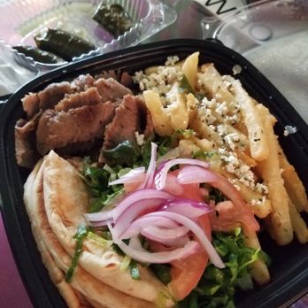 G Y R O - Gyro platter with Greek style fries- dolmas in background - Greek Near Me - Freehold Township, New Jersey G Y R O - Gyro platter with Greek style fries- dolmas in background - Greek Near Me - Freehold Township, New Jersey