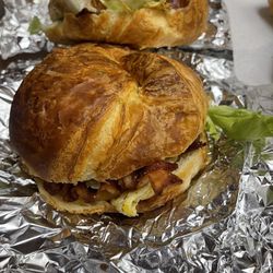 Bacon egg cheese croissant with avocado & lettuce.