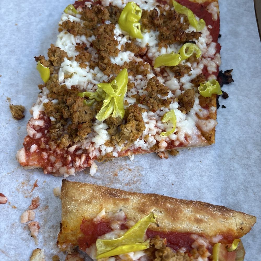 Vegan cheese and sausage pizza