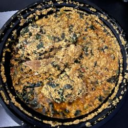 Egusi Soup with pounded yam and goat meat