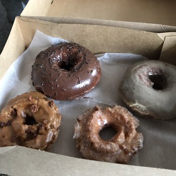 Doughnut Vault - Top Left: Chocolate Top Right: Chestnut Bottom Left: Whiskey Caramel Pecan (Daily Special) Bottom Right: Buttermilk - Donuts Near Me - Chicago, Illinois Doughnut Vault - Top Left: Chocolate Top Right: Chestnut Bottom Left: Whiskey Caramel Pecan (Daily Special) Bottom Right: Buttermilk - Donuts Near Me - Chicago, Illinois