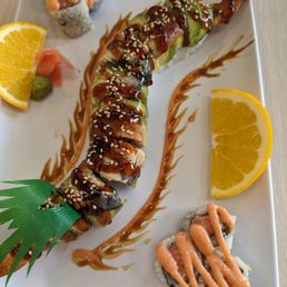Dragon roll in the middle, spicy tuna roll in the corners. Dragon roll in the middle, spicy tuna roll in the corners.