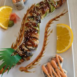 Chop-stix Bourbon BBQ & Sushi - Dragon roll in the middle, spicy tuna roll in the corners.