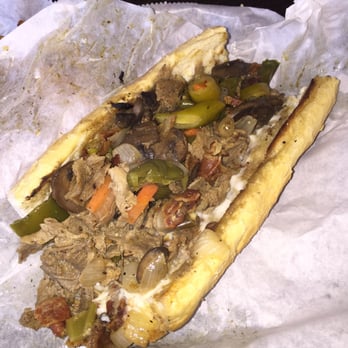 Blaze-N-Grill - Philly steak with Bacon peppers Swiss cheese and the bread French garlic bread - Burgers Near Me - Chicago, Illinois Blaze-N-Grill - Philly steak with Bacon peppers Swiss cheese and the bread French garlic bread - Burgers Near Me - Chicago, Illinois