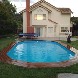 16' x 28' Full Recess Doughboy pool with wrap-around deck.