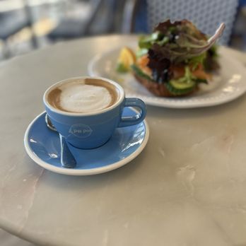 Le Petit Paris - Double espresso with smoked salmon on croissant. - French Near Me - Atlantic Beach, Florida Le Petit Paris - Double espresso with smoked salmon on croissant. - French Near Me - Atlantic Beach, Florida