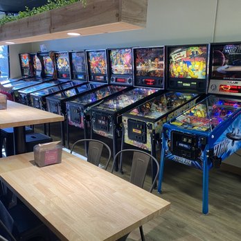 Das Flipperhaus - Seating area running down the middle and "older" pinball machines. - Arcades Near Me - Rocklin, California