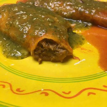 Erick's Enchiladas - two enchiladas on a yellow plate - Mexican Near Me - Omaha, Nebraska Erick's Enchiladas - two enchiladas on a yellow plate - Mexican Near Me - Omaha, Nebraska