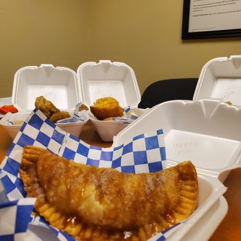 YourPanadas - a picture of a table full of food - Empanadas Near Me