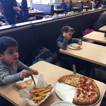 Safari Playground - Kids enjoying their pizza - Playgrounds Near Me - Walled Lake, Michigan