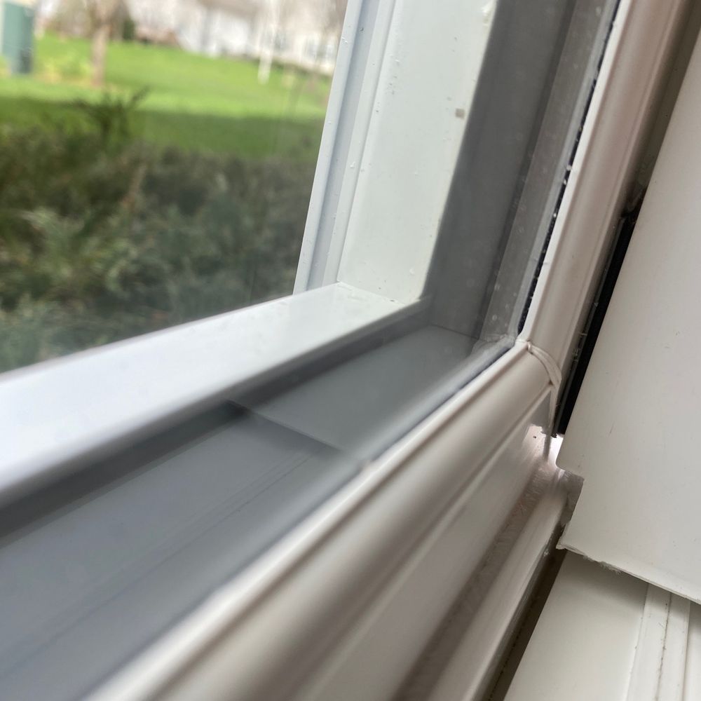 Opal Exteriors - You can see the light coming through after they added some flimsy seal. This where the bugs started to come in. - Windows Installation Near Me - Naperville, Illinois