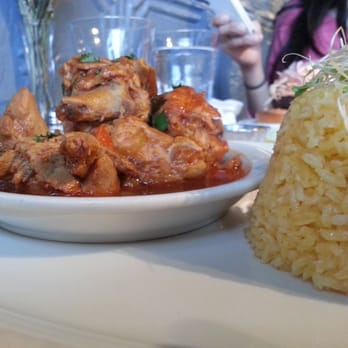 Puerto Viejo - Stew chicken and yellow rice - Dominican Near Me - Brooklyn, New York Puerto Viejo - Stew chicken and yellow rice - Dominican Near Me - Brooklyn, New York