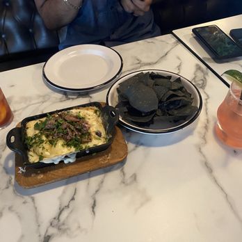 Oak & Ember - Queso fundido, La Niña fresa cocktail to the right and a whiskey based drink to the left (I forgot the came of it but it was delicious!) - Halal Near Me - Ontario, California Oak & Ember - Queso fundido, La Niña fresa cocktail to the right and a whiskey based drink to the left (I forgot the came of it but it was delicious!) - Halal Near Me - Ontario, California