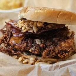 Dirty Bird sandwhich: Crispy Chicken Breast w/honey bbq sauce, double smoked bacon, crispy onion straws, pickles & chipotle ranch. A