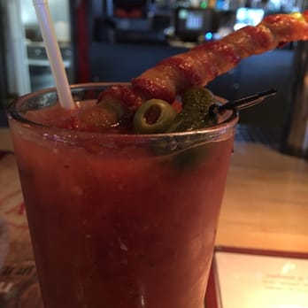 The Alibi Bar & Grill - Yum Bloody Mary. Bacon wrapped asparagus ;) - Bars Near Me - Ionia, Michigan