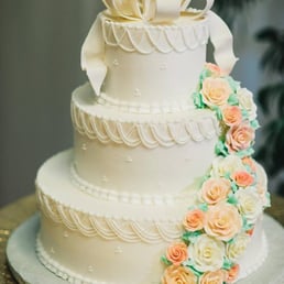 Cake that I got from Chantilly, with bow on top and flowers not matching wedding colors.
