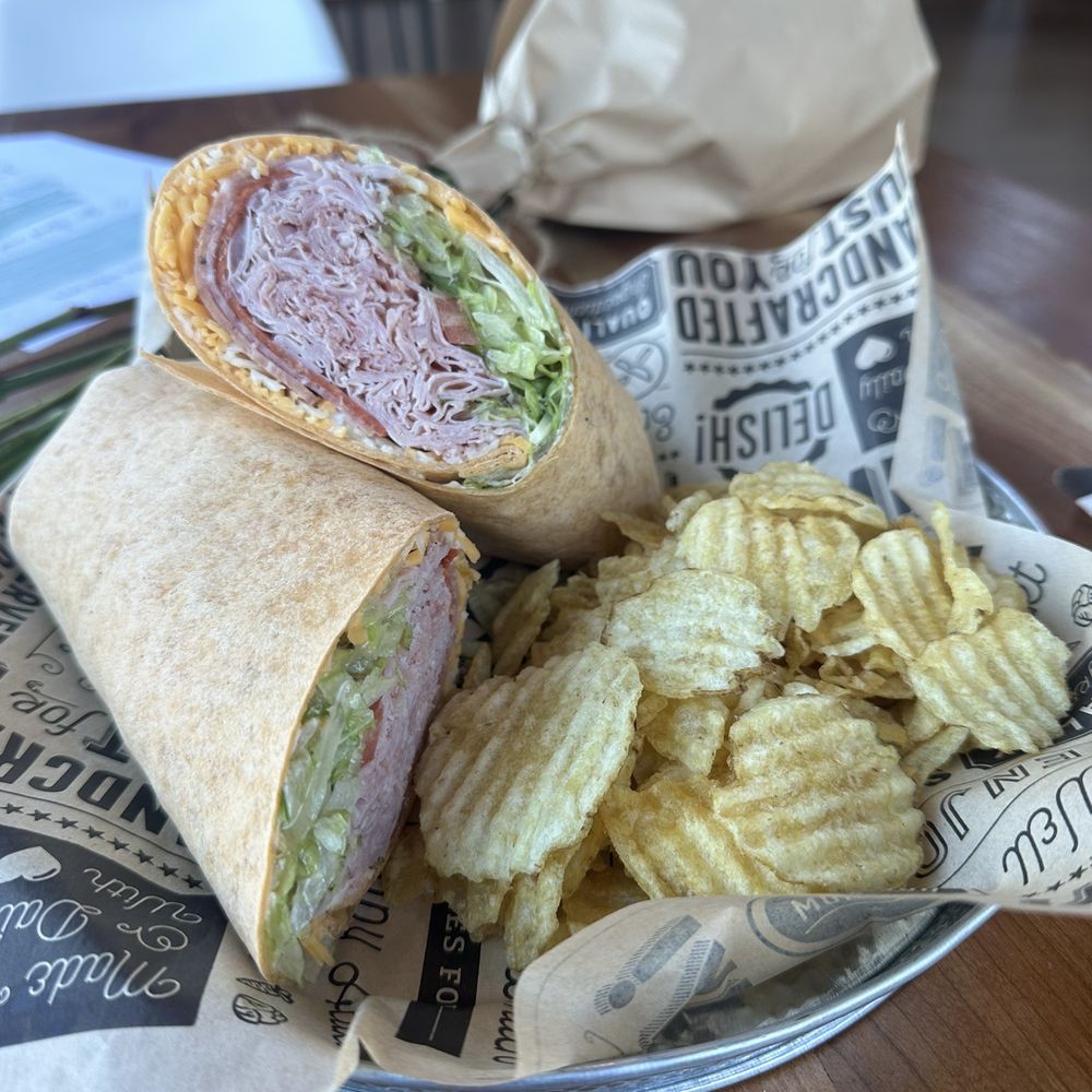 Savory Café and Catering - The Italian overstuffed wrap - mostly ham, made with shredded cheddar cheese (!?!), with potato chips. I declined the pickle. - Cafes Near Me - Hershey, Pennsylvania Savory Café and Catering - The Italian overstuffed wrap - mostly ham, made with shredded cheddar cheese (!?!), with potato chips. I declined the pickle. - Cafes Near Me - Hershey, Pennsylvania