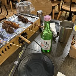Chicken, Mongolian beef, and lamb skewers with lychee soju and rose milk tea Chicken, Mongolian beef, and lamb skewers with lychee soju and rose milk tea