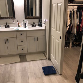 Diaz Remodeling - Master bath and closet- sticky tile and carpet removed and replaced with porcelain tile. New baseboards. - General Contractors Near Me